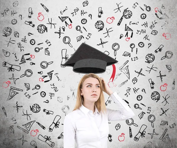 Confused woman and education icons, concrete — Stock Photo, Image