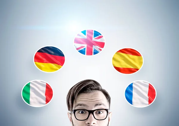 Hipster guy and country flags — Stock Photo, Image