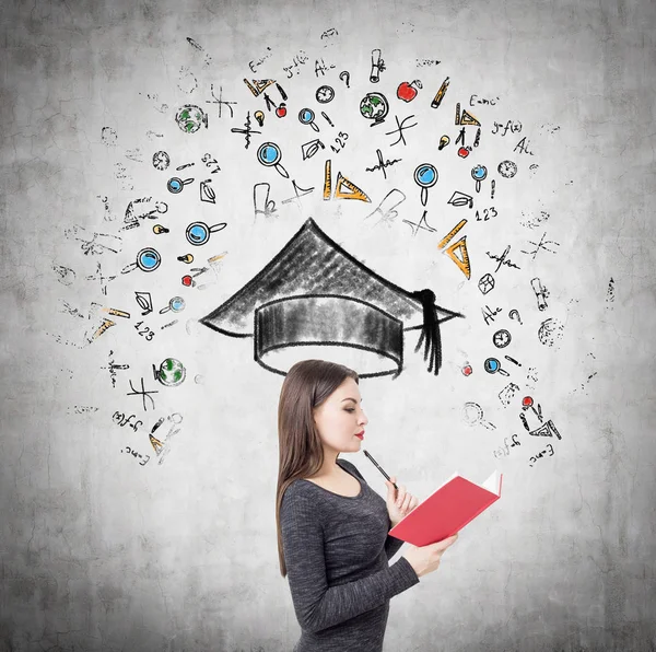 Side view of a girl with red book and education — Stock Photo, Image