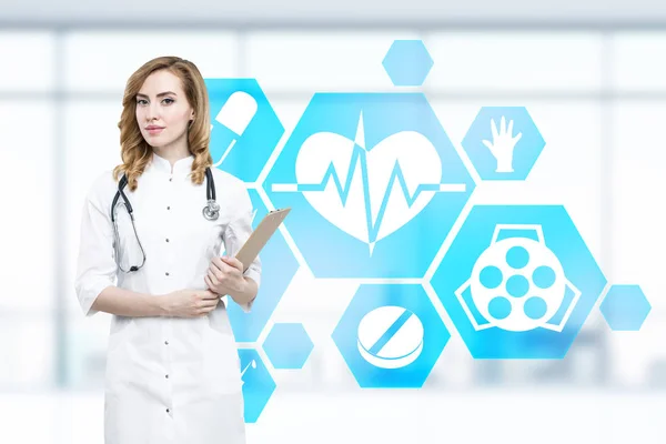 Mujer médico e iconos médicos azules —  Fotos de Stock