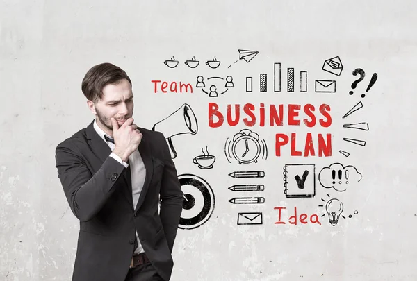 Pensive bearded man and business plan icons