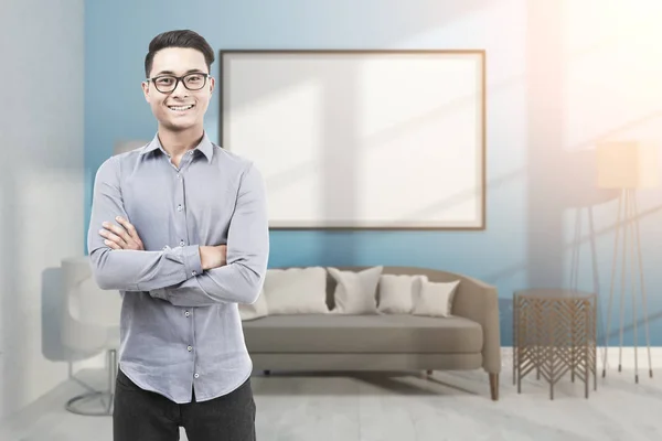 Asian man in glasses in blue room with whiteboard — Stock Photo, Image