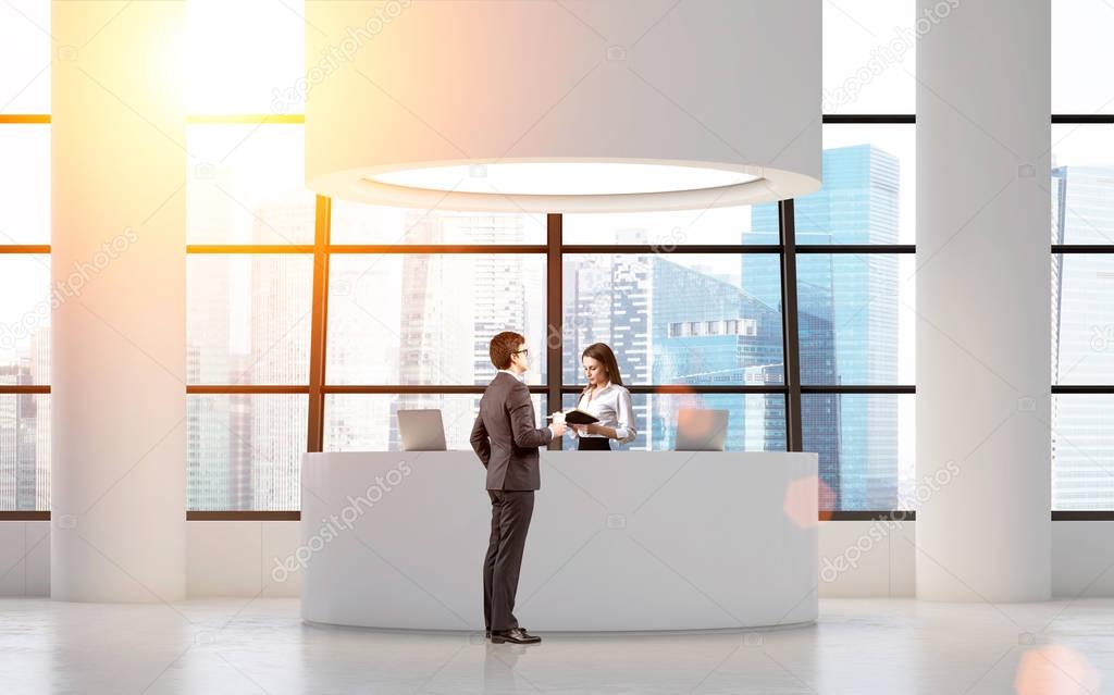 Businessman near a round reception desk