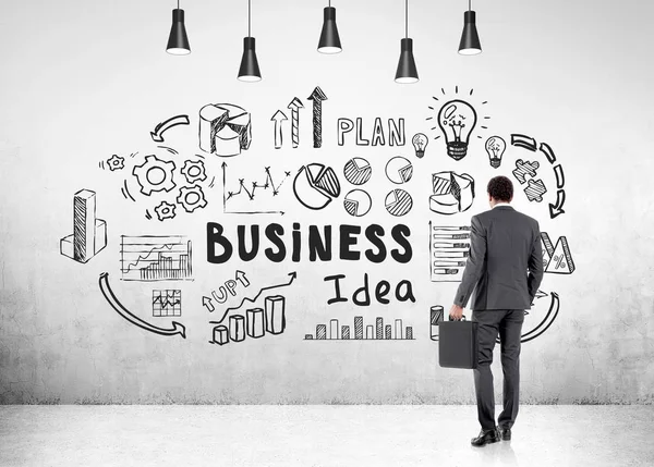 Uomo con valigia e idea di business — Foto Stock