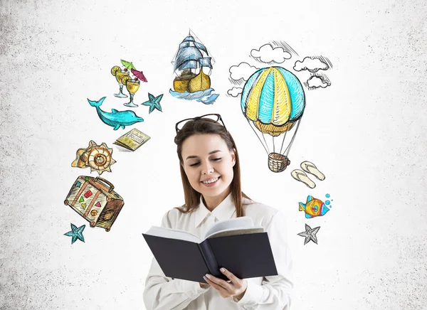 Girl with book and travelling sketches — Stock Photo, Image