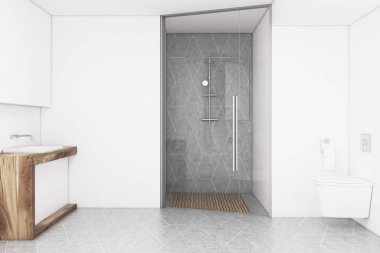 Banyo beyaz bir duvar ve cam kapı