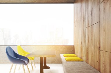 Mavi ve sarı tonda sandalye sahip kafe