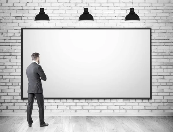 Man in suit and blank whiteboard — Stock Photo, Image