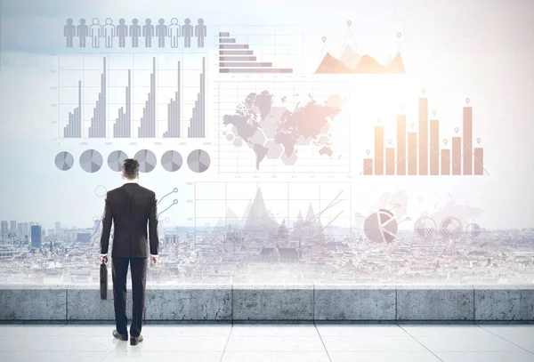 Man on roof and graphs in the sky — Stock Photo, Image