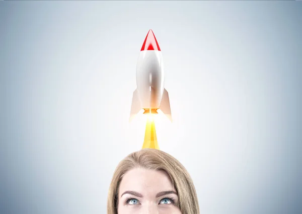 Blond woman head and rocket — Stock Photo, Image