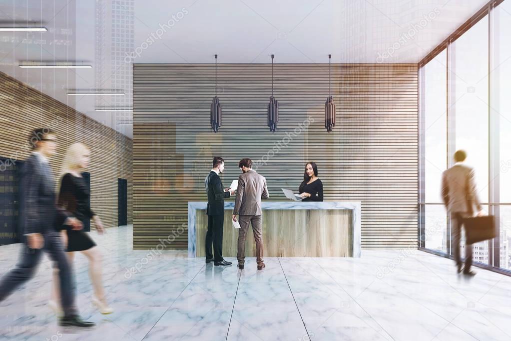 Wood reception, marble floor, front, people