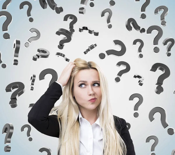Woman scratching head and questions — Stock Photo, Image