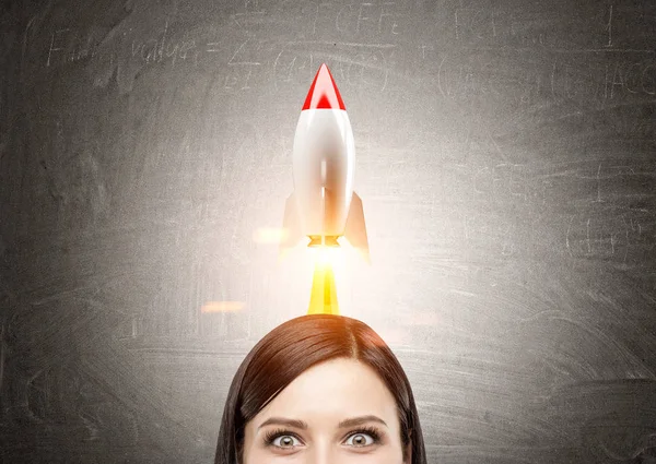 Woman with black hair and rocket — Stock Photo, Image