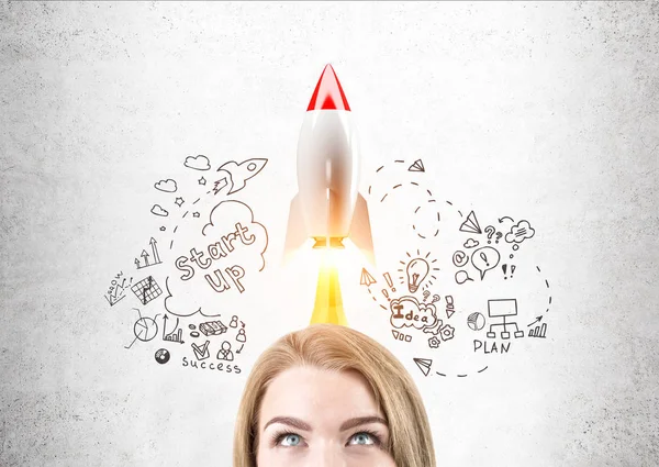 Blond woman head and start up rocket — Stock Photo, Image