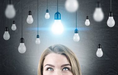 Blond woman s head and many bulbs clipart