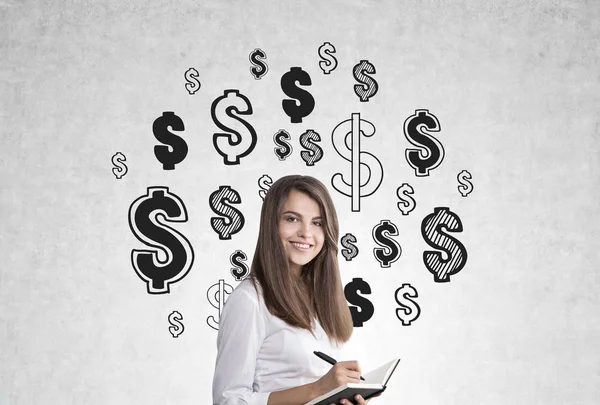 Woman with notebook and dollar signs — Stock Photo, Image