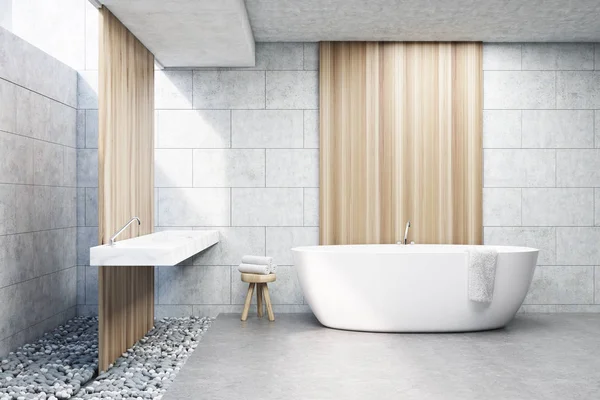 Baño de ladrillo gris, bañera blanca, frente —  Fotos de Stock