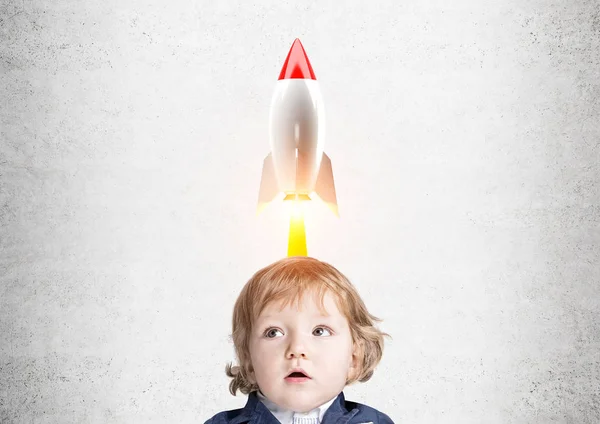 Baby boy and a rocket — Stock Photo, Image