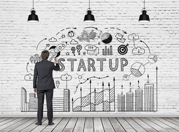 Man drawing start up diagram — Stock Photo, Image