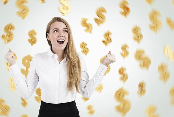 Happy blond businesswoman and dollar signs — Stock Photo, Image