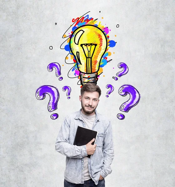 Man with notebook, light bulb and questions — Stock Photo, Image