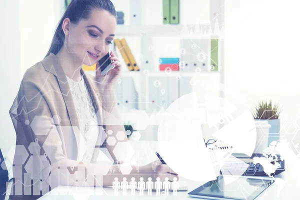 Kvinna på telefon i office, grafer — Stockfoto