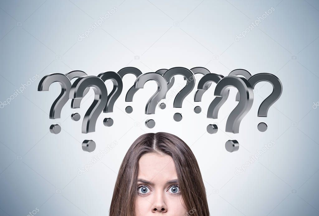 Confused woman and question marks