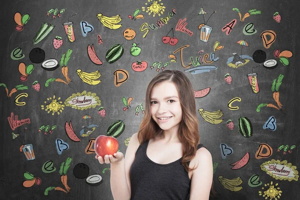 Chica con manzana y frutas, pizarra —  Fotos de Stock
