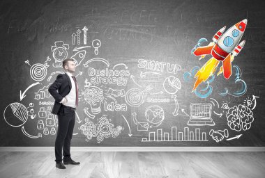 Kendine güvenen işadamı ve roket başlamak yukarıya