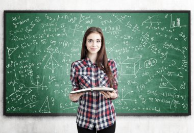 Teen girl with book near blackboard, formulas clipart