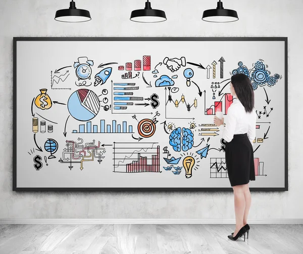 Woman with coffee looking at bright scheme — Stock Photo, Image