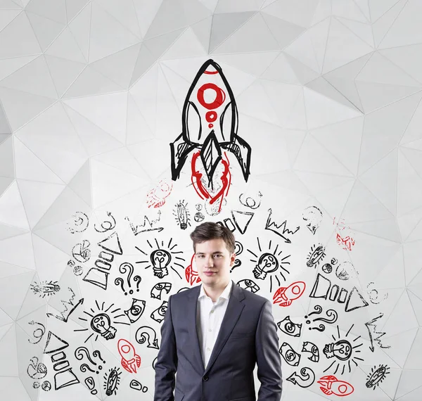 Young businessman and black and red start up — Stock Photo, Image