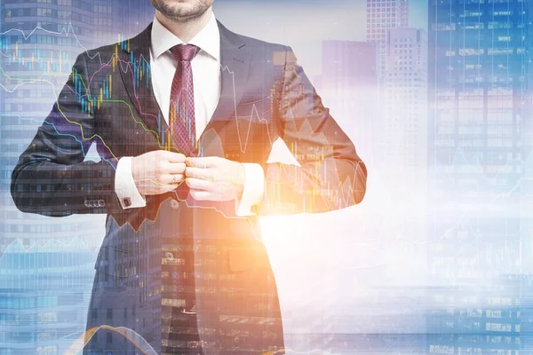 Man buttoning suit in a city, graphs — Stock Photo, Image