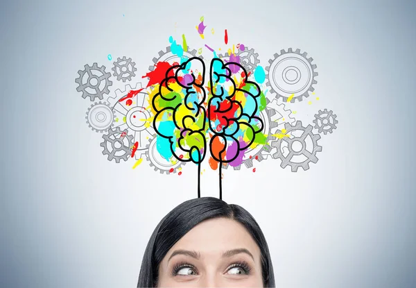 Woman s head, brain and cogs — Stock Photo, Image