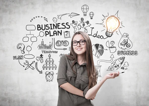 Woman with marker and business plan