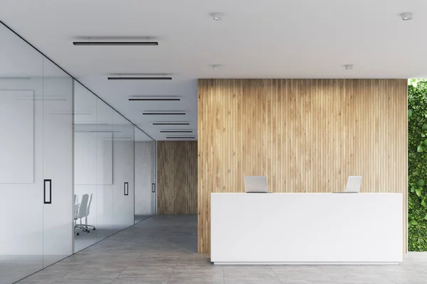 White reception, wooden office, front