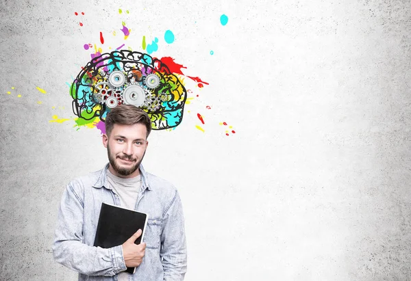 Skeptical young businessman and brain with cogs — Stock Photo, Image