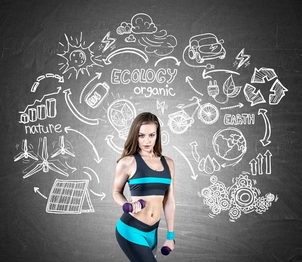 Fit girl with dumbbells and ecology icons — Stock Photo, Image
