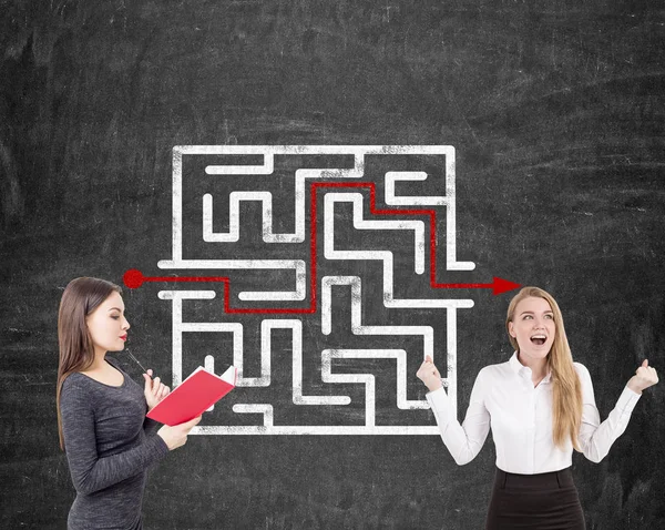 Two businesswomen looking for a way out — Stock Photo, Image