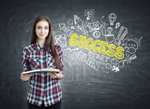 Geek girl with a book and success — Stock Photo, Image