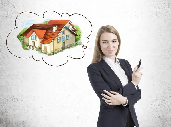 Blond real estate agent and a house — Stock Photo, Image