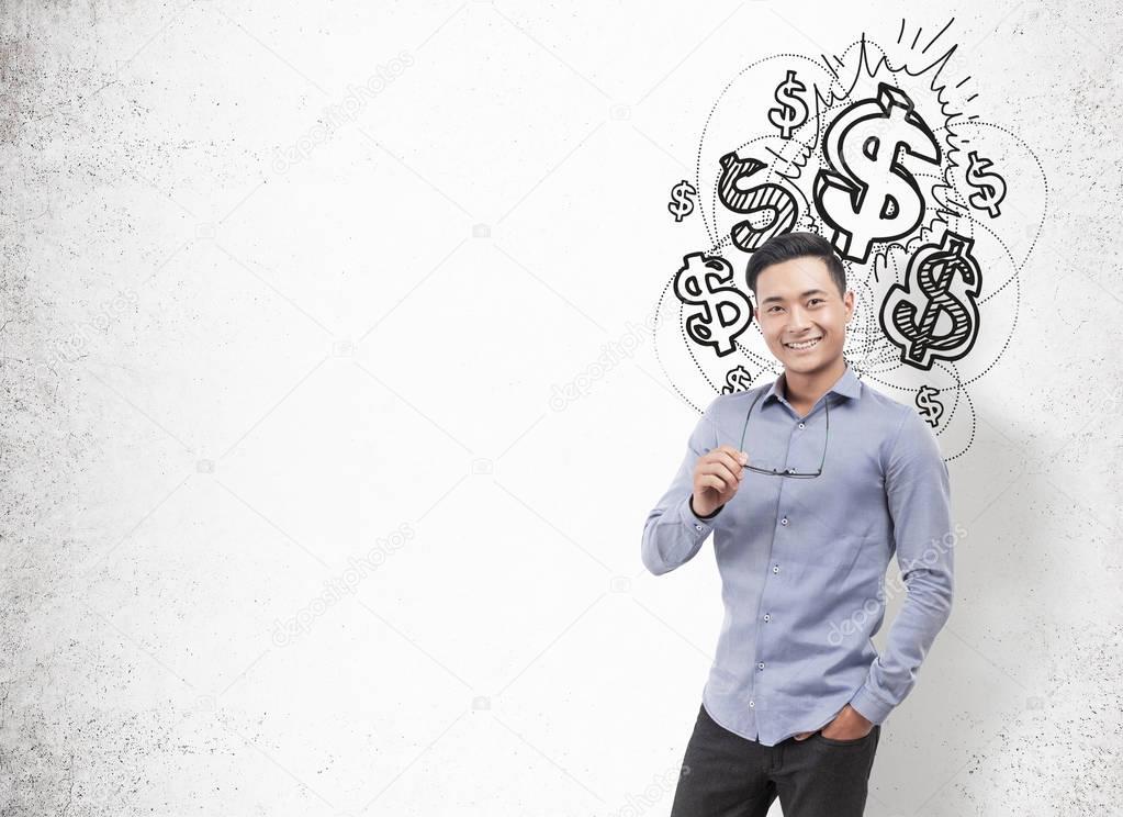 Asian businessman holding glasses, dollars