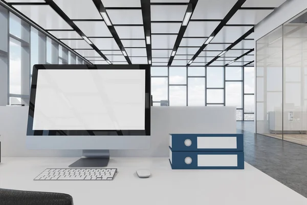 Blank computer screen on a white office desk — Stock Photo, Image