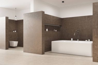 Açısal bir küvet ile kahverengi banyo tuvalet