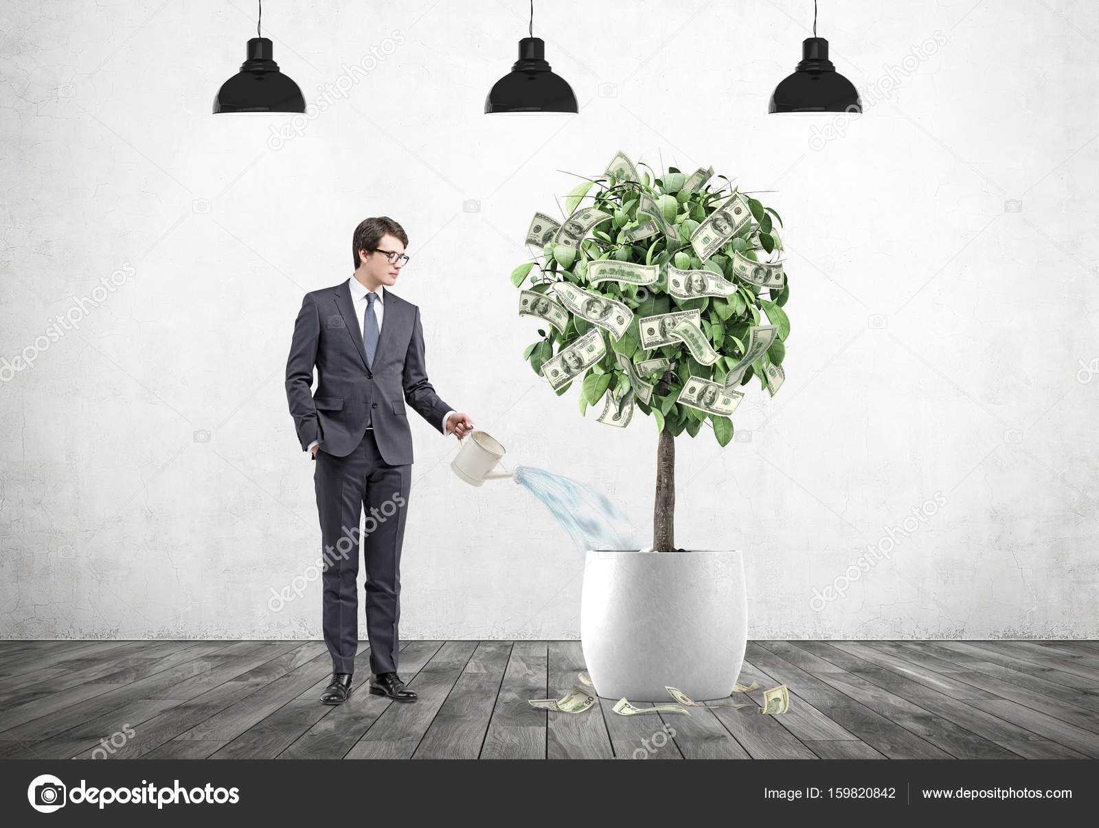 Businessman Watering A Dollar Tree Lamps Stock Photo Businessman Watering A Dollar Tree Lamps Stock Photo