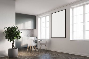 Bir poster, gri mutfak tezgahı ile beyaz mutfak