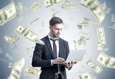 İşadamı Doları yağmur altında bir dizüstü bilgisayar ile