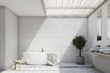 Tuğla banyo iç bir küvet ve bir ağaç