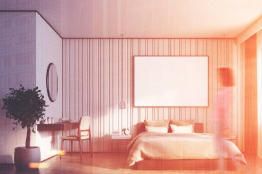 Bej renkli yatak odası büyük bir posteri ile kız