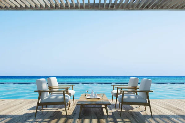 White armchairs and table near a pool — Stock Photo, Image